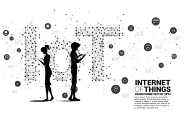 Silhouette of man use mobile phone standing and Polygon dot connect line shaped IoT wording . Concept for telecommunication and internet of things.