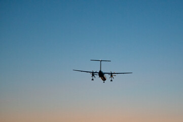 plane lands in the sunset