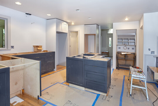 Custom cabinets for kitchen island, desk and counters are set in place
