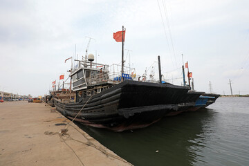 Ships berthing during the summer fishing moratorium are at a fishing port wharf, North China - obrazy, fototapety, plakaty
