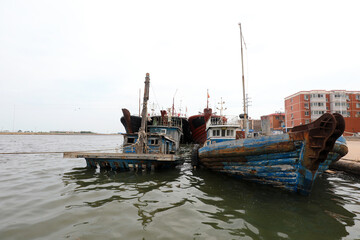 Ships berthing during the summer fishing moratorium are at a fishing port wharf, North China