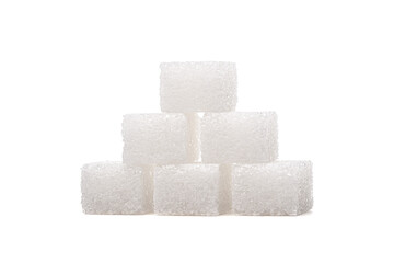 Sugar cubes on one another, isolated on white background.
