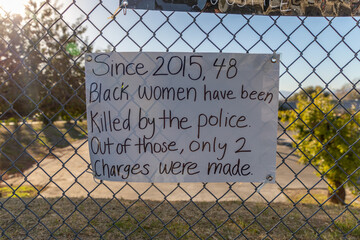 Sign on fence