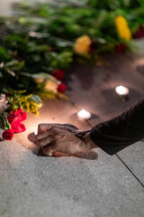 Hand lighting candle at vigil