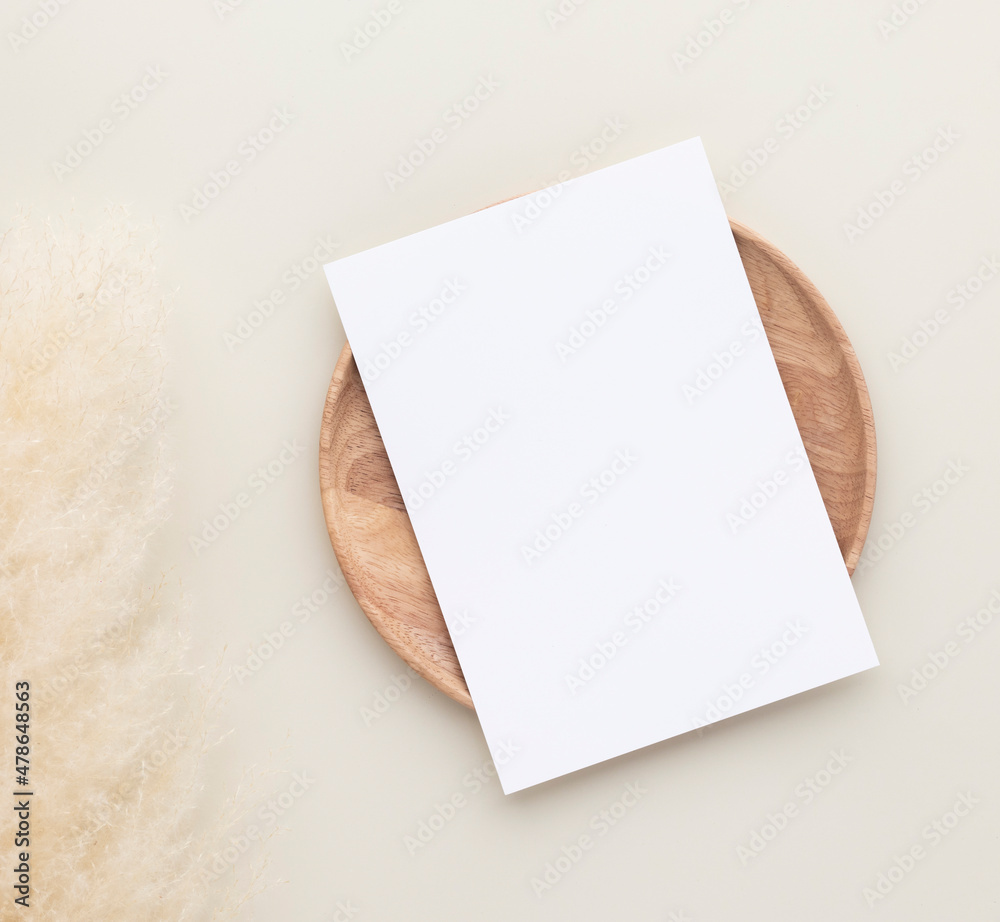 Wall mural blank paper cards, mockup with pampas grass on a wooden plate, beige background, minimal beige workp