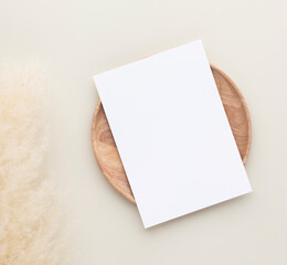 Blank paper cards, Mockup with pampas grass on a wooden plate, beige background, Minimal beige...