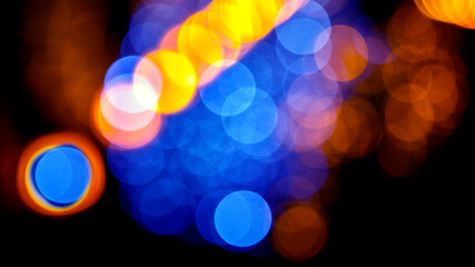 background blurred abstraction of colored lanterns and decorations. bokeh texture of street colored lights