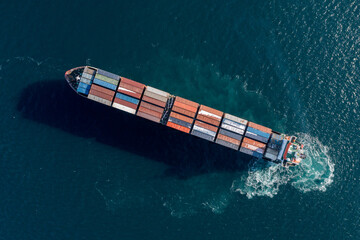 Sea container ship is moving at sea.