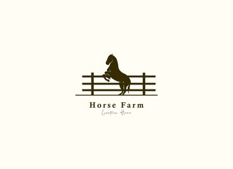Horse silhouette behind wooden fence paddock for vintage retro rustic countryside western country farm ranch logo design