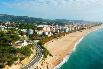 Fototapeta na wymiar Aerial photo of Spanish town Calella with view of beach and residential buildings.
