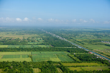 Fototapeta na wymiar Water Canal Irragation and Farming in West Demerara Guyana