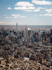 Helicopter view of the Empire State Building on a sunny day in New York City