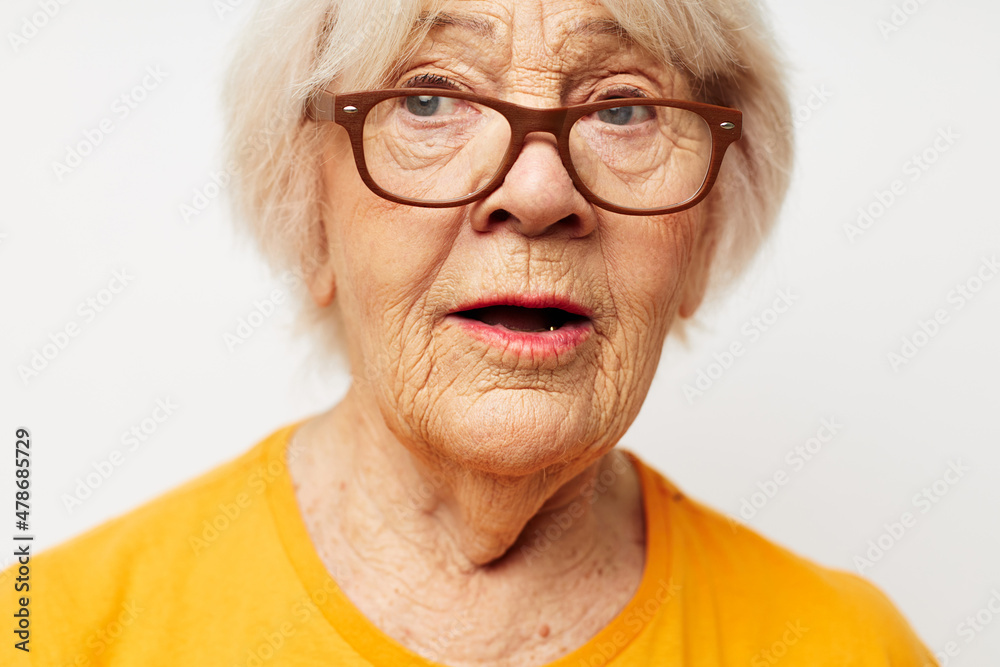 Wall mural Photo of retired old lady health lifestyle eyeglasses treatment close-up