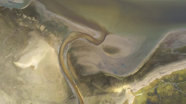 Aerial drone view of land formation in texel wadden sea island mudflats,  netherlands