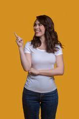 Girl showing the direction with a raised forefinger