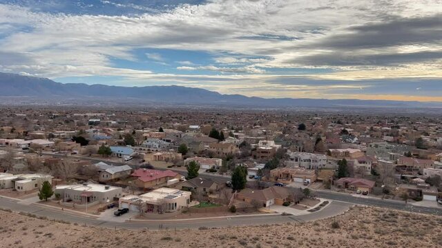 Sandia Mountains on horizon as camera pans across Albuquerque, NM