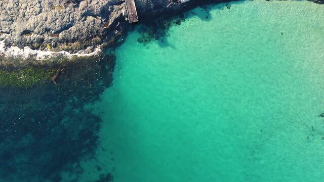 Drone aerial Bawley Point crystal clear reef sand rocks and bridge Pacific Ocean Sydney South Coast Ulladulla NSW Australia 4K
