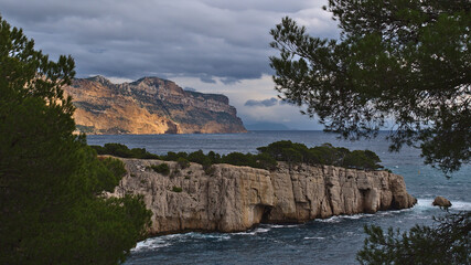 View of the rugged cliffs of mountain range Massif des Calanques near Cassis, French Riviera at the...