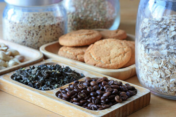 Coffee beans, green tea and biscuits for breakfast