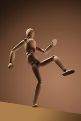 Confident  wooden man take a step on brown background. Dramatic concept.