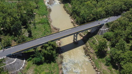 A vehicular traffic bridge over a large river in Yogyakarta, Indonesia