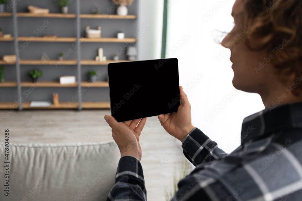 Poster Man Using Tablet Computer With Empty Screen Controlling House Indoors
