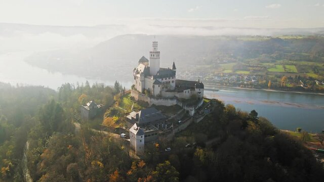 Dreamy Marksburg Castle in hill. Aerial view, Braubach, Germany, Rhine UNESCO