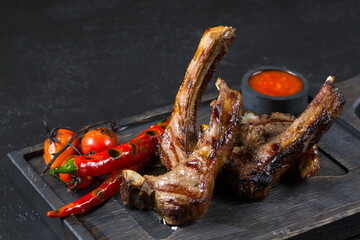 lamb square with hot pepper on a wooden board.