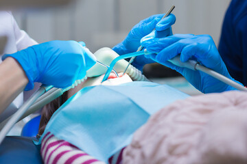 Dentistry. Dental treatment for children in the clinic under sedation.
