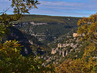 View of popular canyon Gorges de la Nesque in the Vaucluse Mountains in Provence region, France on sunny day in autumn season with rugged limestone. - obrazy, fototapety, plakaty