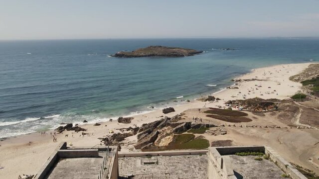 Aerial pullback from Pessegueiro Island reveal Nossa senhora da Queimada Fort, Porto Covo