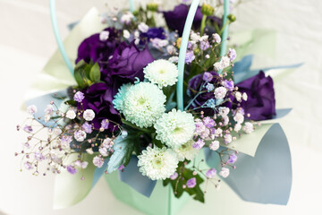 purple bouquet of roses and chrysanthemums. white background