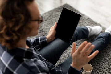 Guy Video Calling Waving To Blank Digital Tablet Screen Indoor