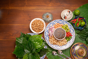 Miang Kham Or wild betel leaves Wrap Ingredients dried shrimps, peanuts, lime, chilli, roasted...