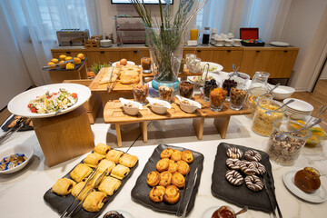 Breakfast served on a buffet table in a hotel restaurant