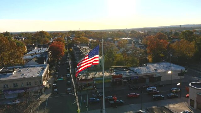 Aerial Orbit View of a Large American Flag in the Middle of an Urban Neighborhood - Part 2