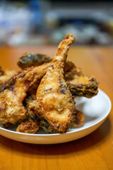 A plate of delicious fried grass carp belly closeup