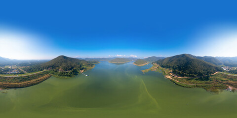 360 panorama by 180 degrees angle seamless panorama of aerial top view of a dam with forest trees,...