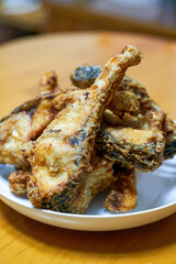 A plate of delicious fried grass carp belly closeup