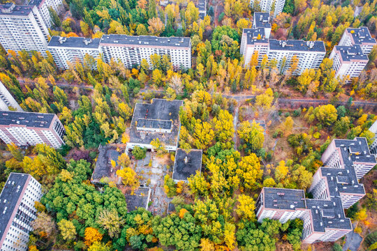 Ukraine, Kyiv Oblast, Pripyat, Aerial view of rooftops of abandoned city in autumn
