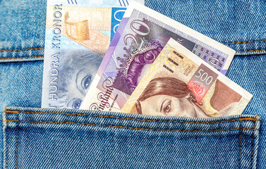 European currency banknotes sticking out of the jeans pocket