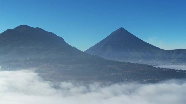 Drone Aerial View Of Two Volcanoes Above Cloud Line. Volcano Santa Maria And Imploded Volcano Cerro Quemado In Quetzaltenango, Xela Guatemala.