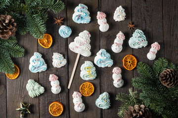 Airy biscuits in the shape of snowmen and Christmas trees.Christmas and New Year concept.