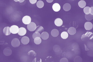 Very Peri, backdrop for the festive decoration of the New Year, Christmas, birthday, anniversary and other holiday or greeting card. Defocused image.