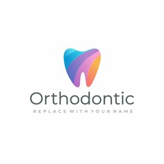 Dental logo with a rainbow color tooth icon