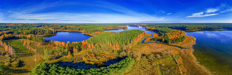 The autumn landscape of Masuria, the land of a thousand lakes in north-eastern Poland - obrazy, fototapety, plakaty