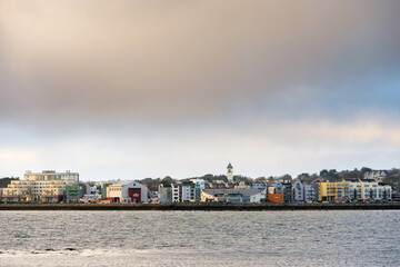 Salthill promenade area of Galway city, Ireland. Popular tourists attraction. Cloudy sky.
