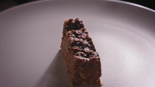 Spinning Plate With a Delicious Piece of Chocolate Oat Cake - Steady Shot