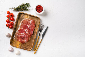 Prosciutto crudo, italian salami, parma ham, on white stone table background, top view flat lay,...