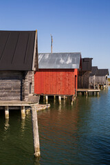 Old traditional wooden boathouses at the Maritime Quarter in Mariehamn, Åland Islands, Finland, on a sunny day in the summer.